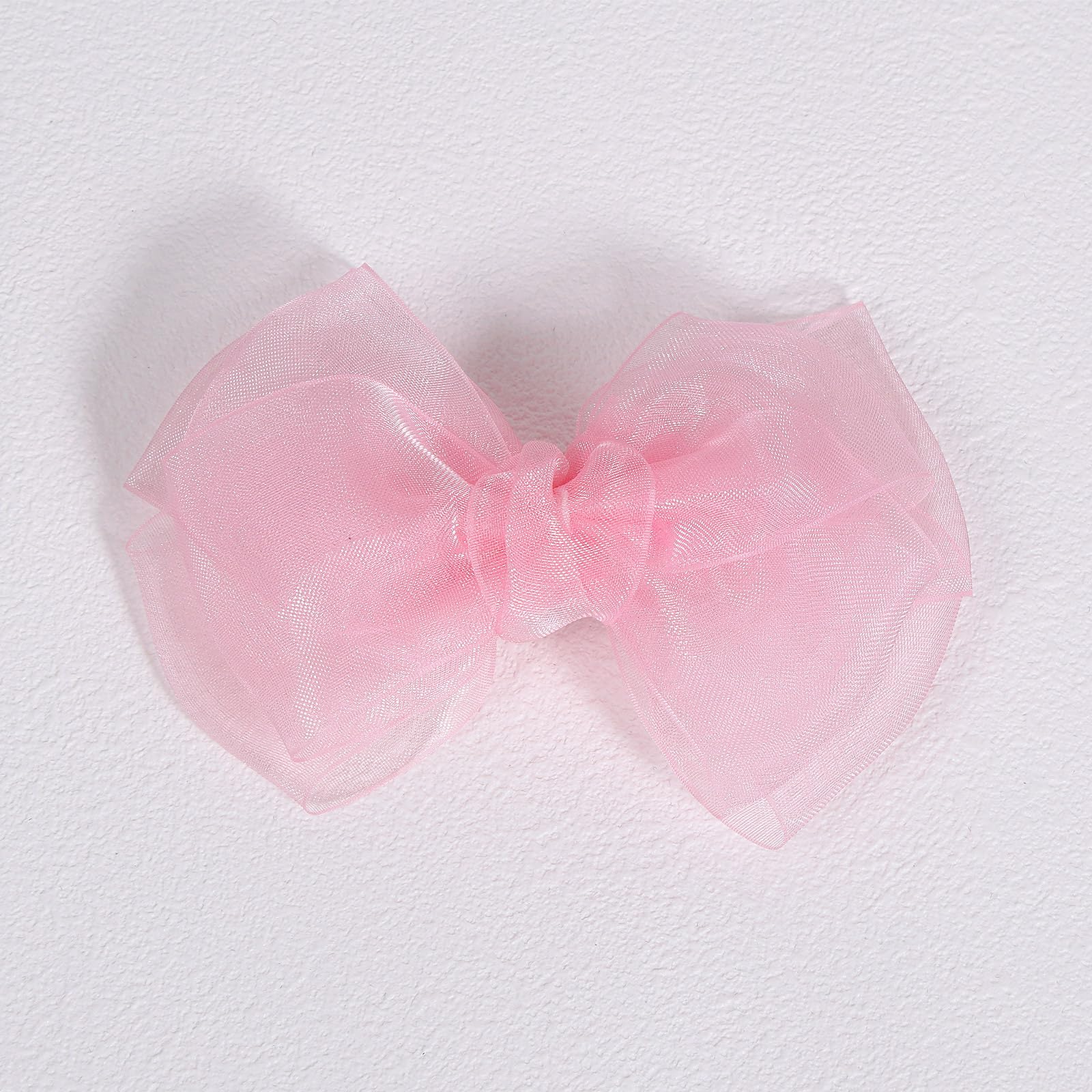 KCHIES bow paired with a party dress illustrating outfit coordination and elegance