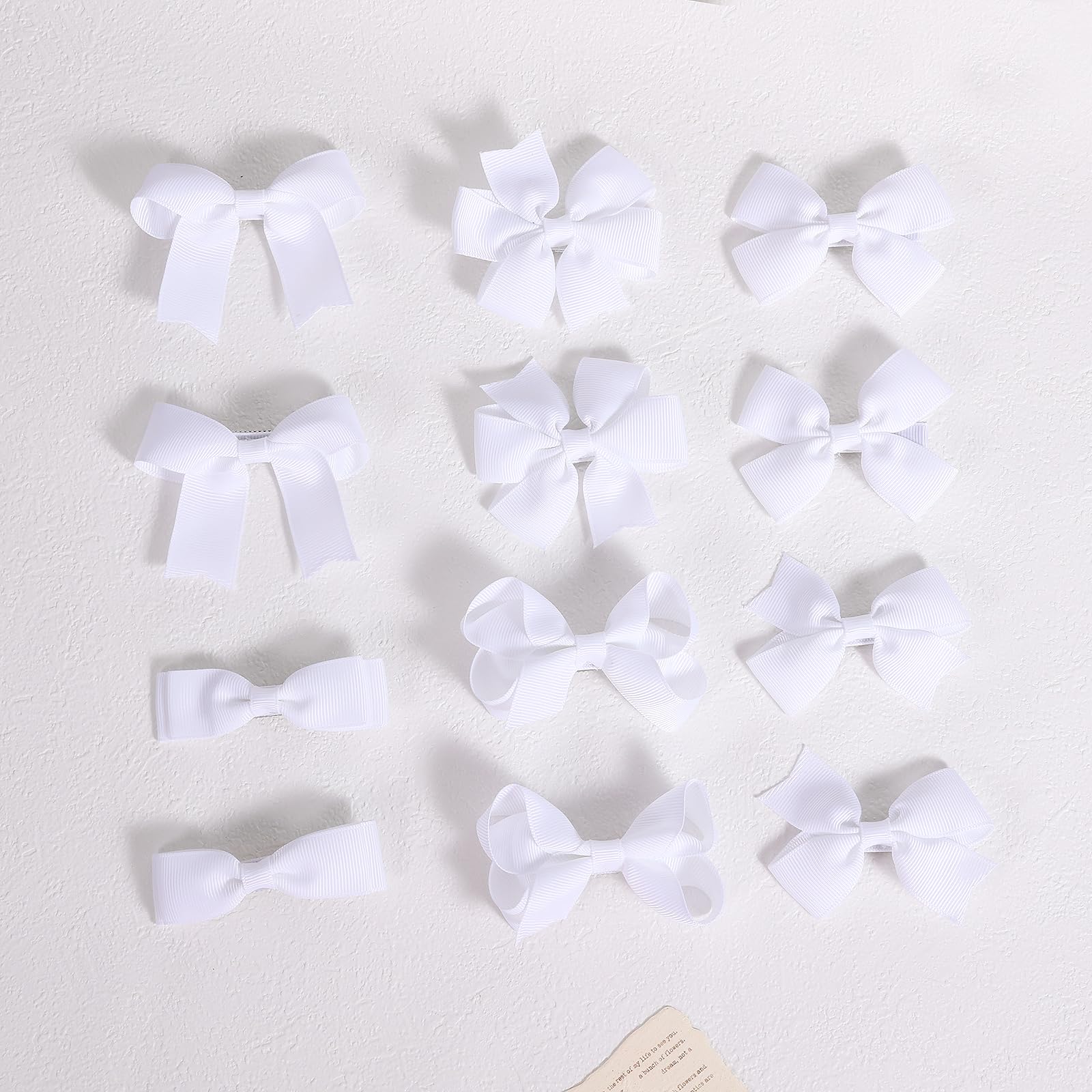 KCHIES bow beside ruler showing 3-inch size for correct fit consideration
