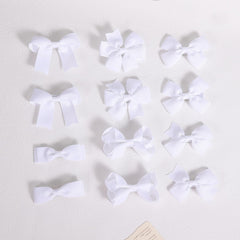 KCHIES bow beside ruler showing 3-inch size for correct fit consideration