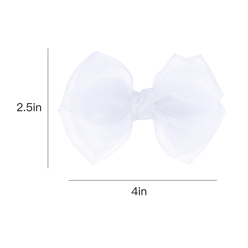 KCHIES bow styled with a dress showing bridal or pageant-ready coordination