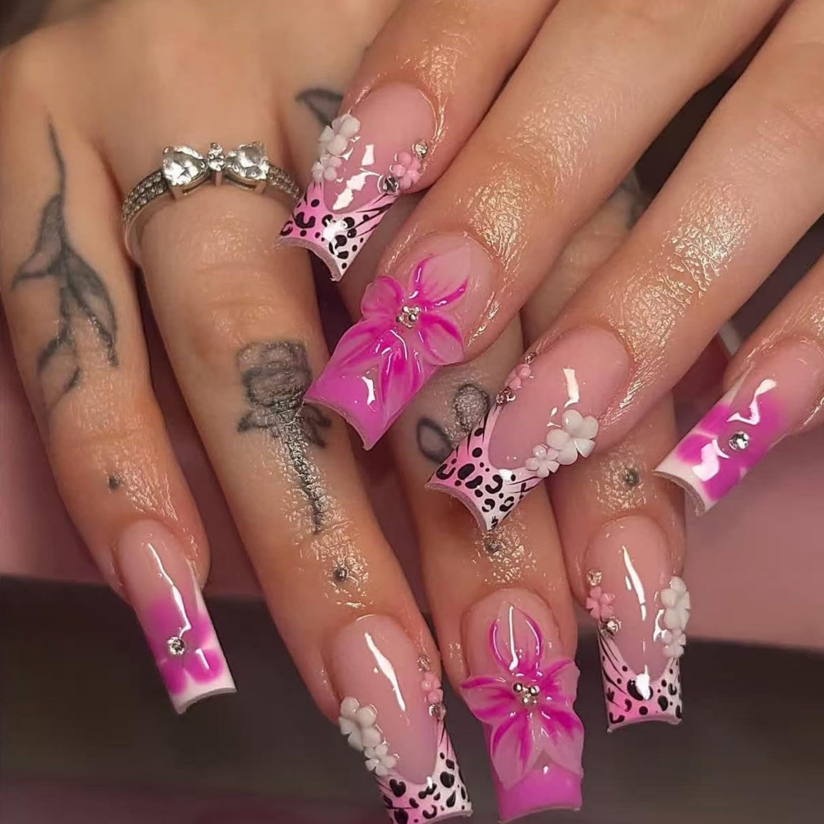 Kcjckcdd front packaging showing 24-piece pink floral and leopard press-on set for easy gifting