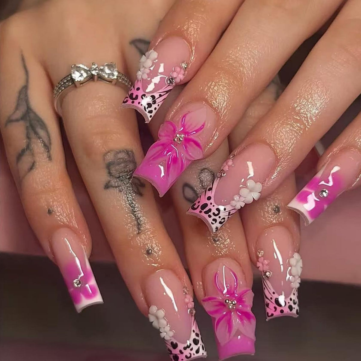 Kcjckcdd front packaging showing 24-piece pink floral and leopard press-on set for easy gifting