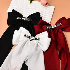 Kefley bow worn in bridal setting enhancing wedding hairstyle photos