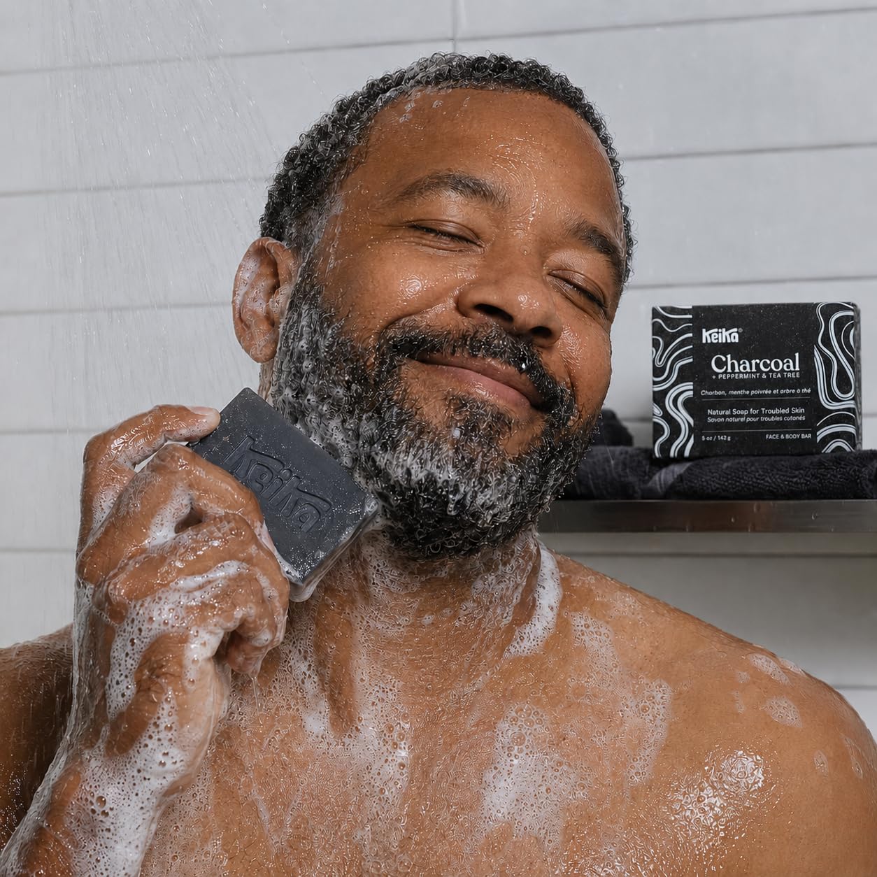 Keika shaving lather in hand demonstrating smooth shave protection
