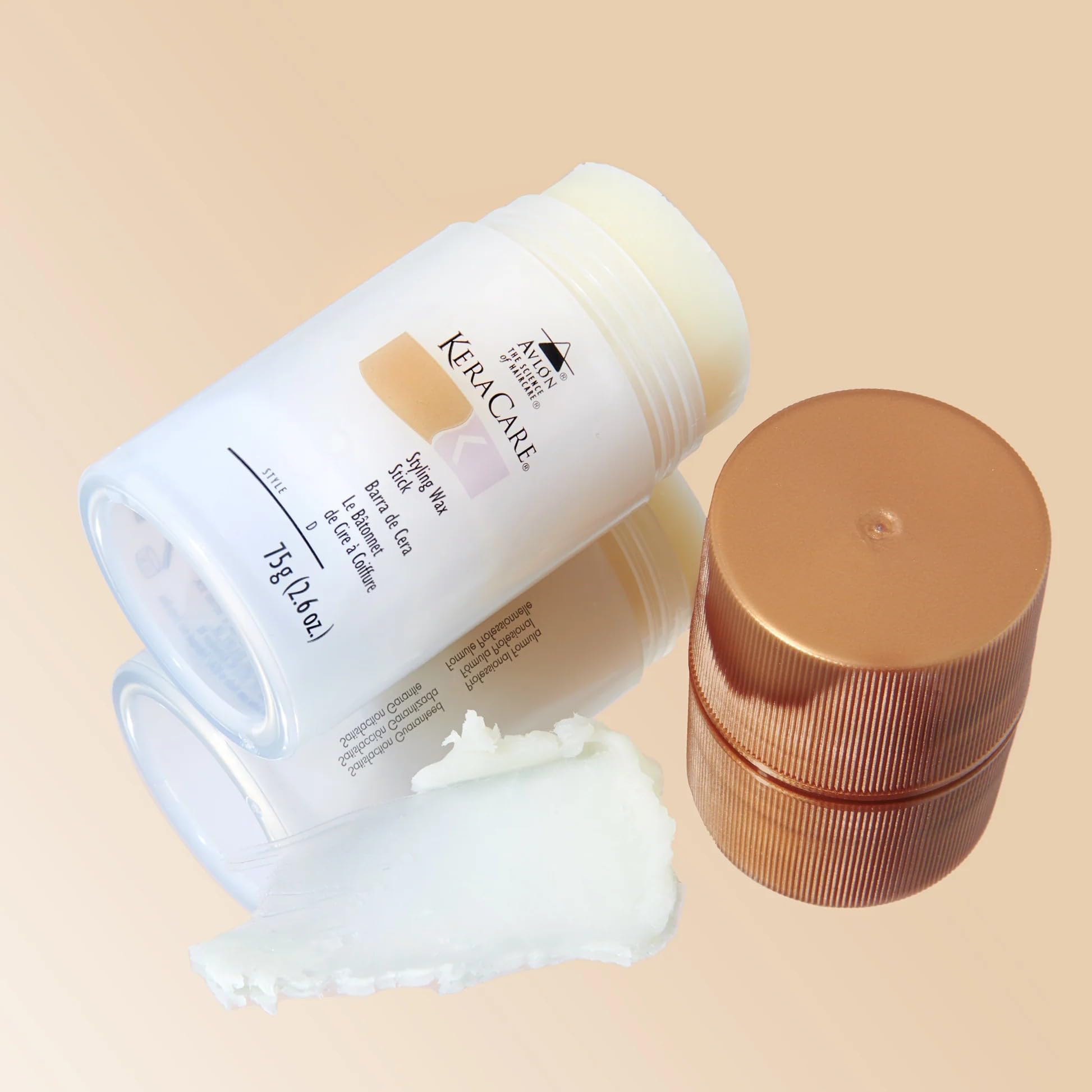 KeraCare size comparison in hand showing compact stick for easy touch-ups