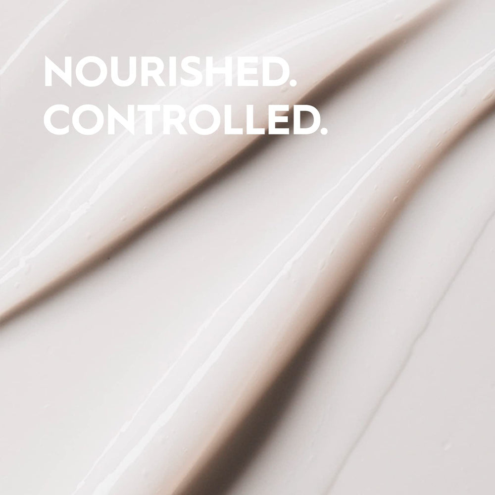 Kerasilk conditioner on hand showing detangling ease