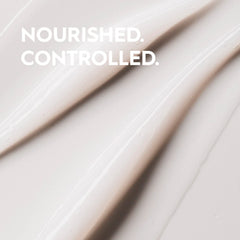 Kerasilk conditioner on hand showing detangling ease