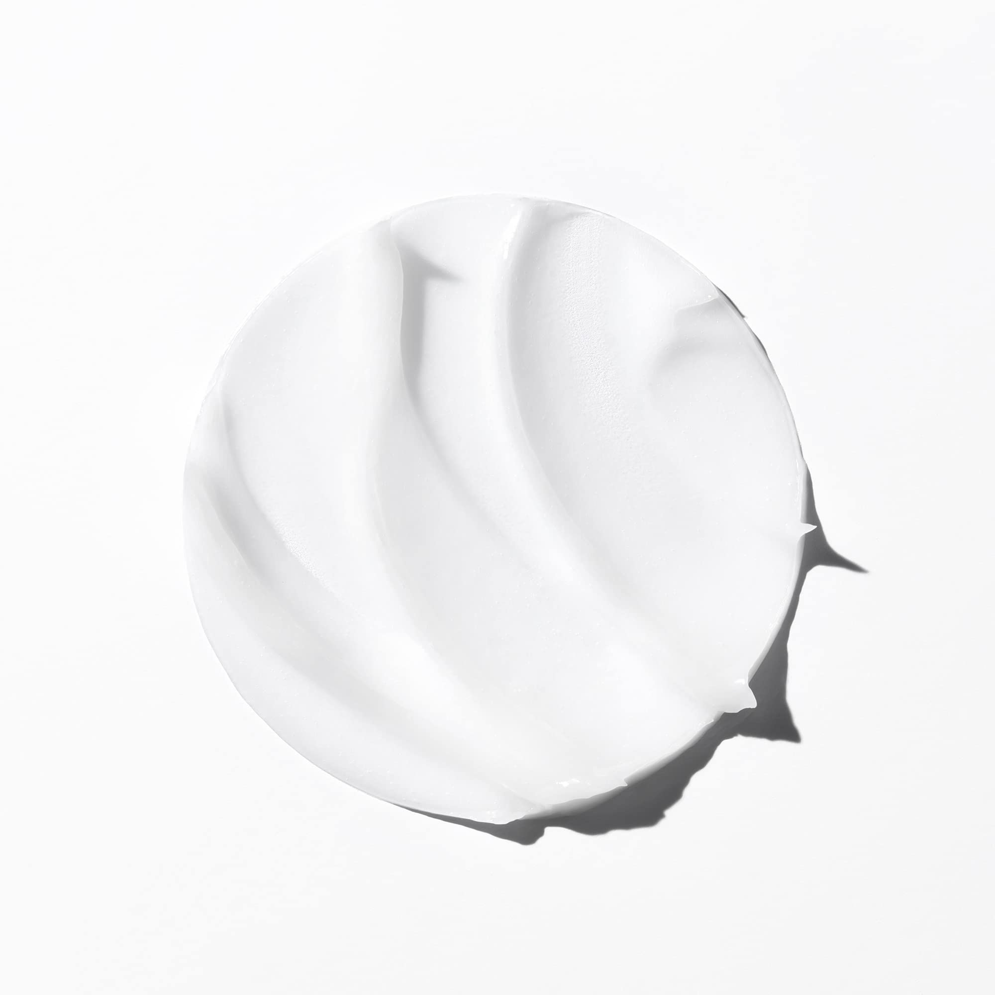 KÉRASTASE label close-up highlighting ingredients for repair and hydration