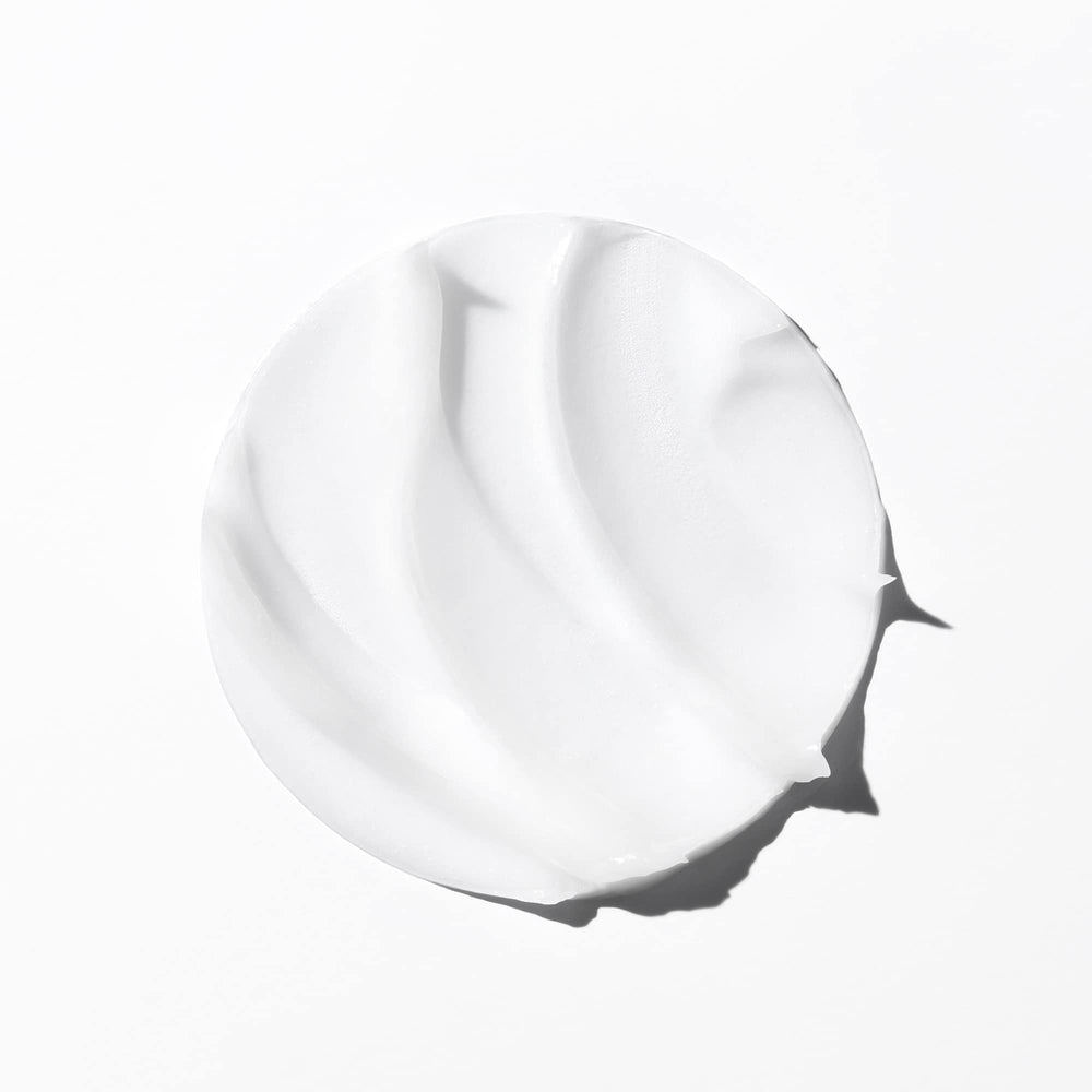 KÉRASTASE label close-up highlighting ingredients for repair and hydration