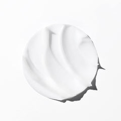 KÉRASTASE label close-up highlighting ingredients for repair and hydration