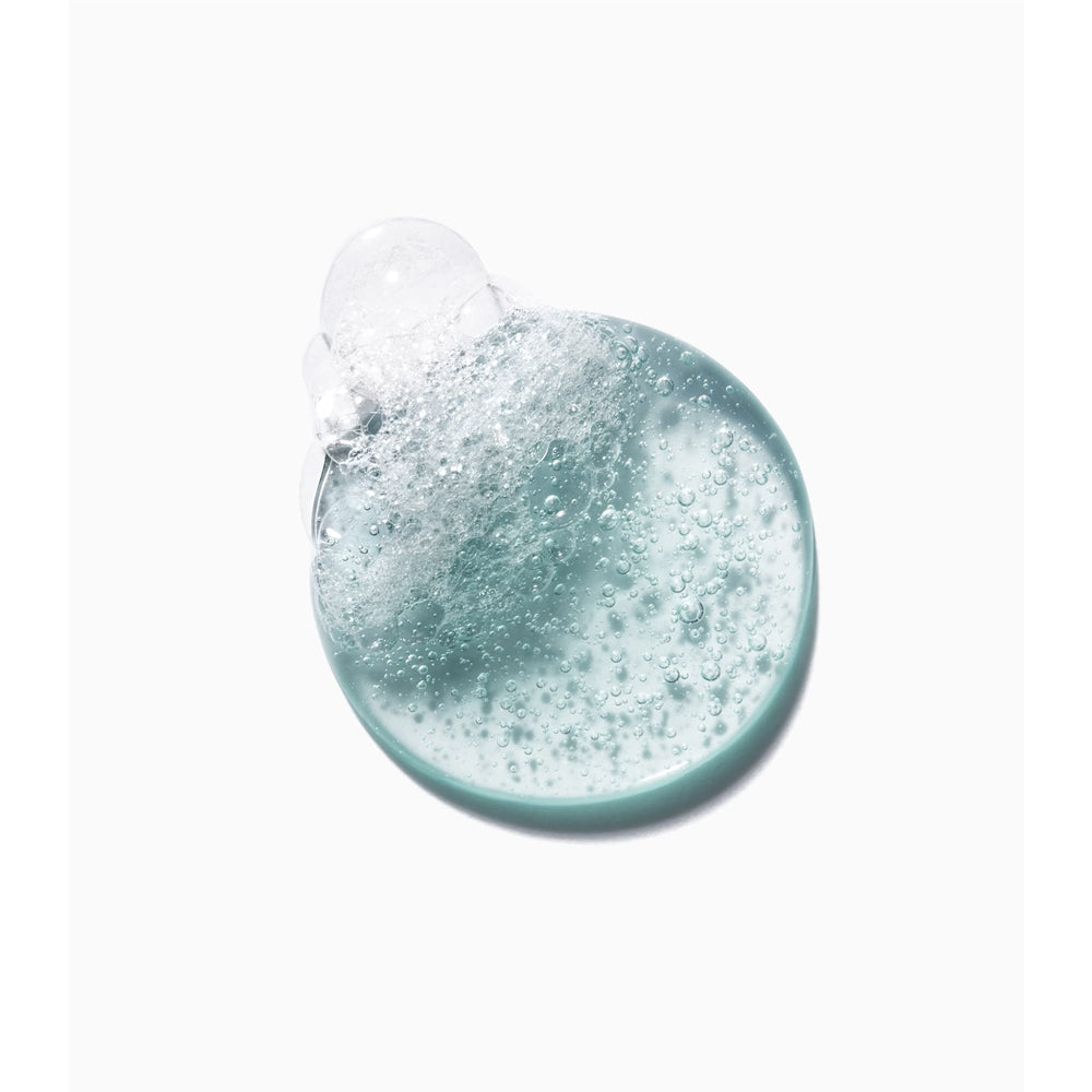 KÉRASTASE bathroom lifestyle shot illustrating daily grooming routine