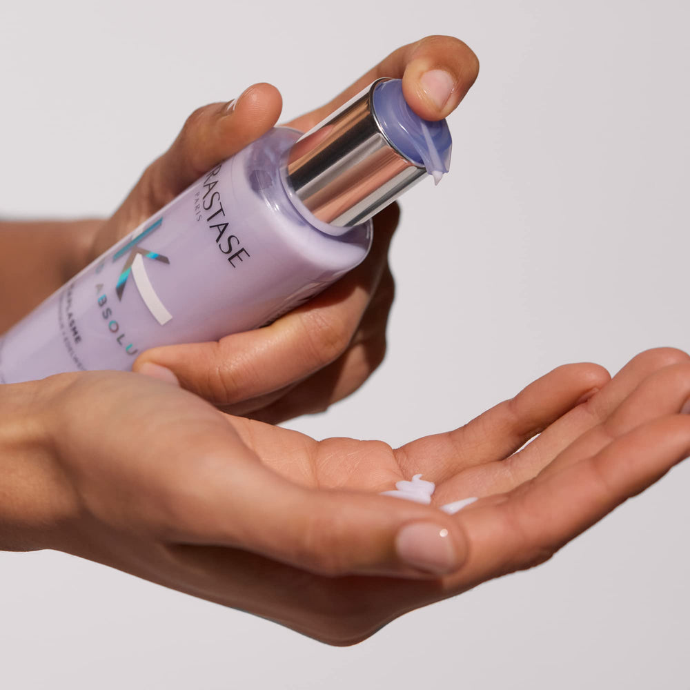 KÉRASTASE used in salon styling showing professional-strength smoothing benefit