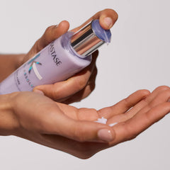 KÉRASTASE used in salon styling showing professional-strength smoothing benefit