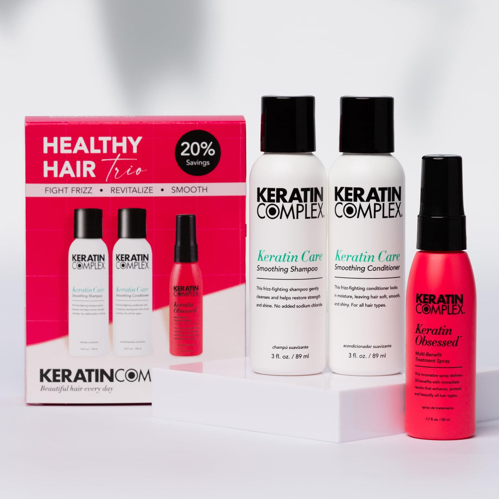 Keratin Complex shampoo and conditioner close-up pumps highlighting smooth texture