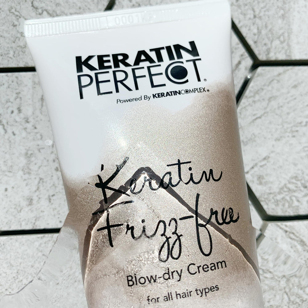 Keratin Perfect applying cream to damp hair demonstrating reduced blow-dry time benefit