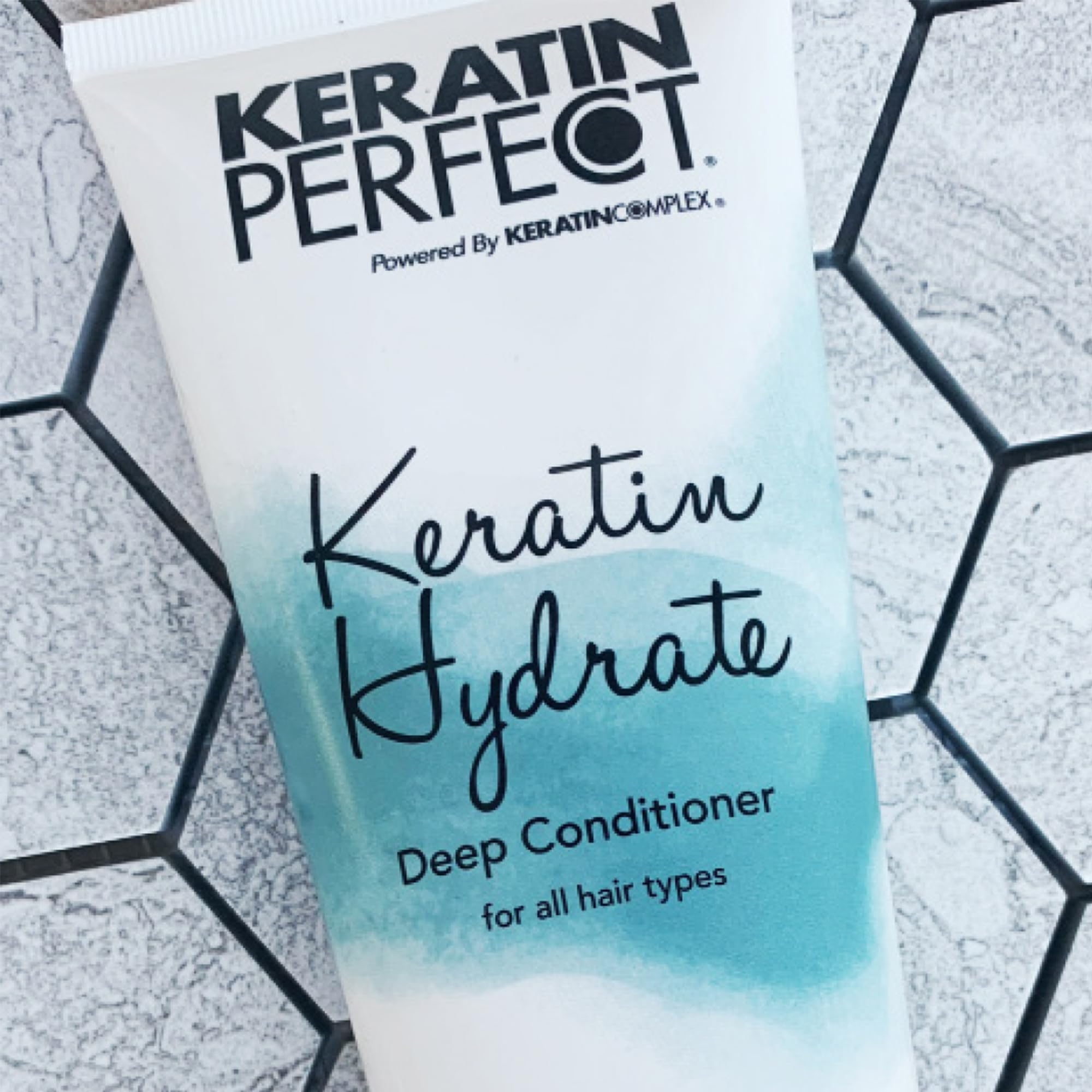 Keratin Perfect next to common 7oz marker showing compact travel-friendly size