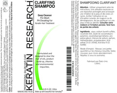 KERATIN RESEARCH 120ml bottle beside coin for compact size comparison
