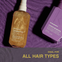 KEVIN.MURPHY 100ml bottle beside hand for scale and travel-friendly benefit