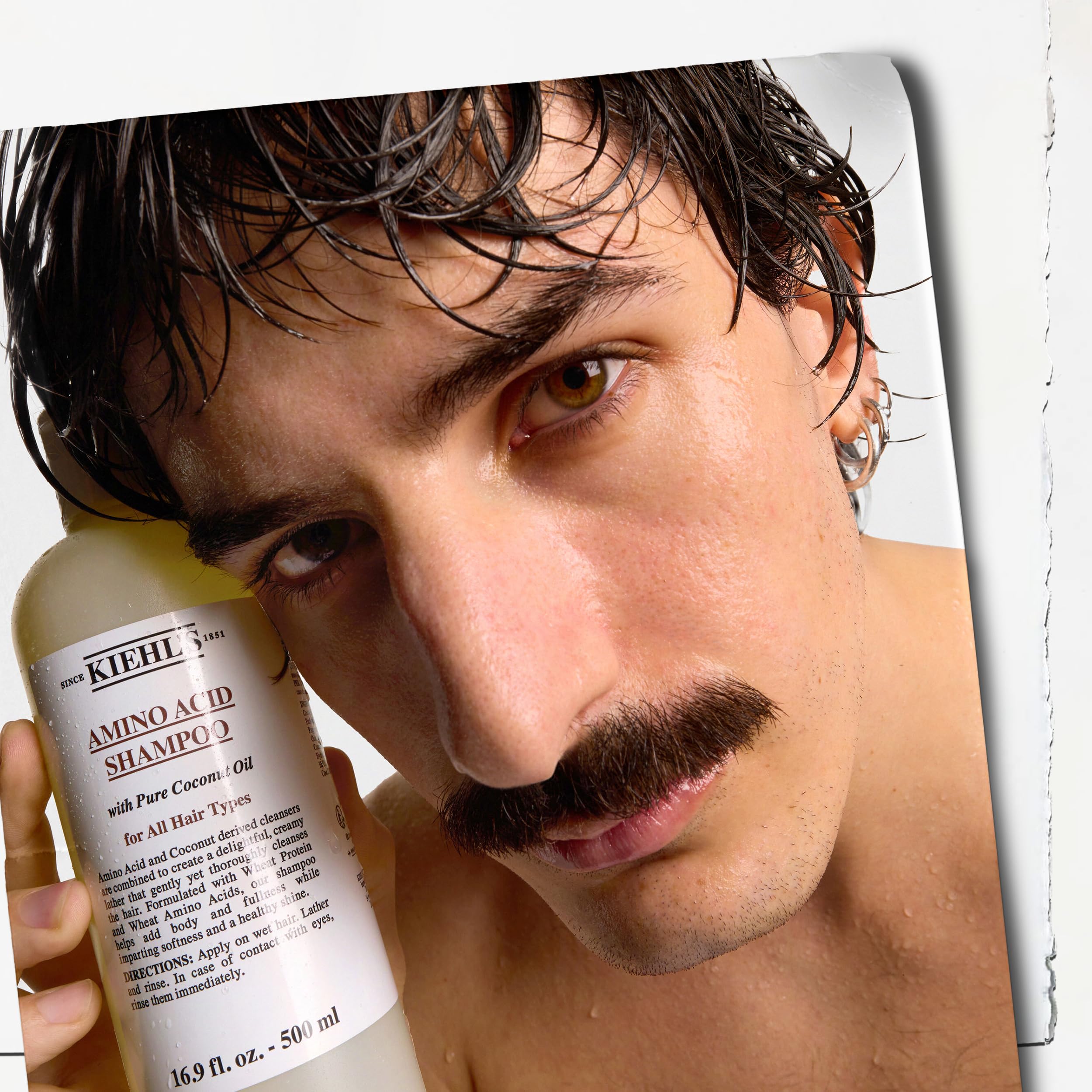 Lifestyle bathroom scene with shampoo by sink showing daily routine benefit