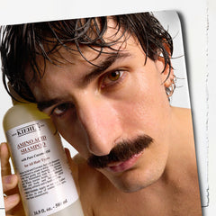 Lifestyle bathroom scene with shampoo by sink showing daily routine benefit