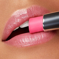 Kiko Milano Coloured Balm 04 in a purse near mirror showing on-the-go touch-up convenience