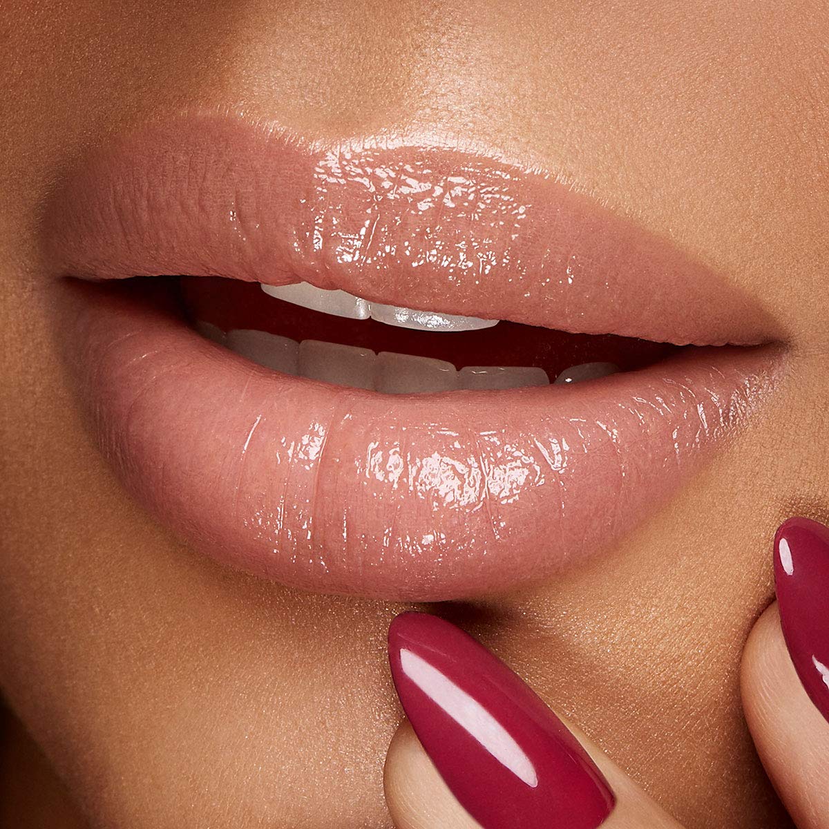Kiko Milano on smiling model showing subtle color and boost to natural lips