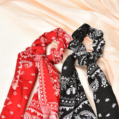 Kilener scrunchie beside ruler showing 8cm diameter and fit benefit