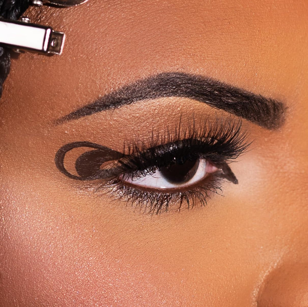Kimchi Chic brown liner swatch on skin showing rich pigment and smooth glide
