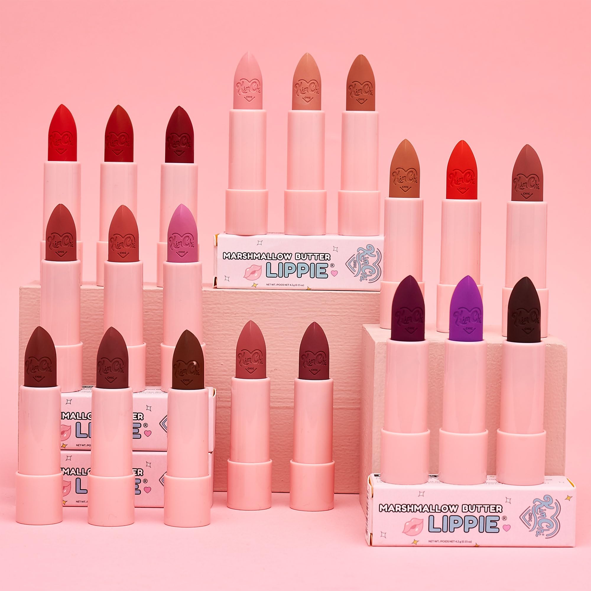 KimChiChic lipstick next to coin showing compact size and travel-friendly benefit