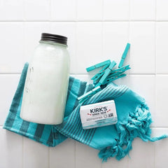 Kirk's soap on bathroom shelf in lifestyle setting showing everyday convenience benefit