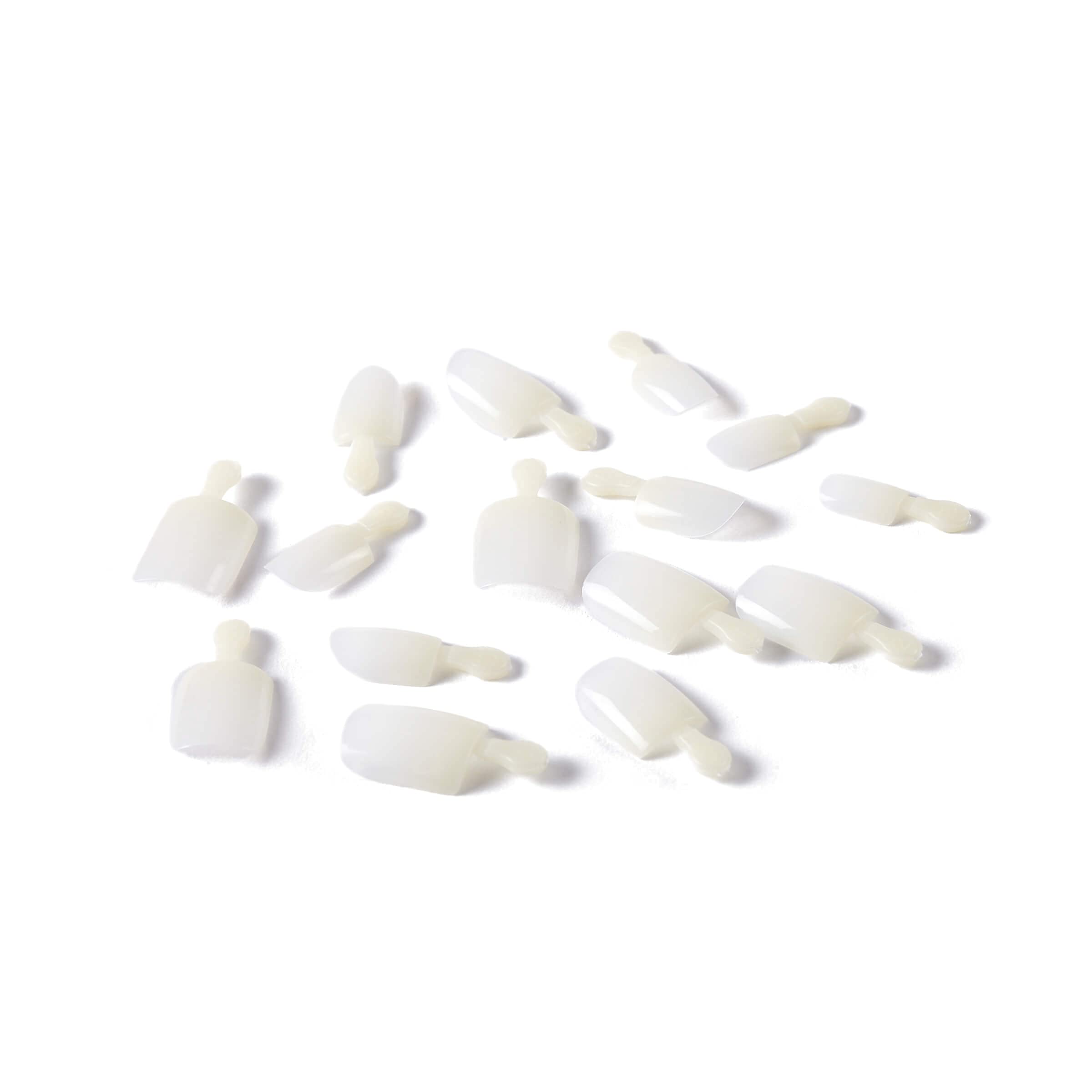KISS 2 g pink nail glue and manicure stick ready for application to ensure reliable adhesion