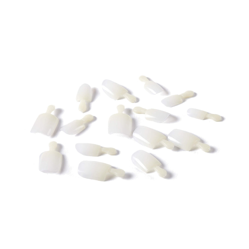 KISS 2 g pink nail glue and manicure stick ready for application to ensure reliable adhesion