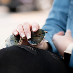 KISS applying a press-on nail with glue demonstrating quick bubble-free adhesion