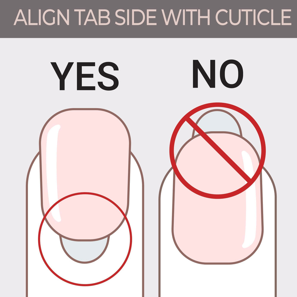 KISS hand with press-on nails next to ruler for medium length scale