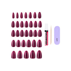 KISS kit contents laid out with 32 nails glue and tools for full at-home manicure