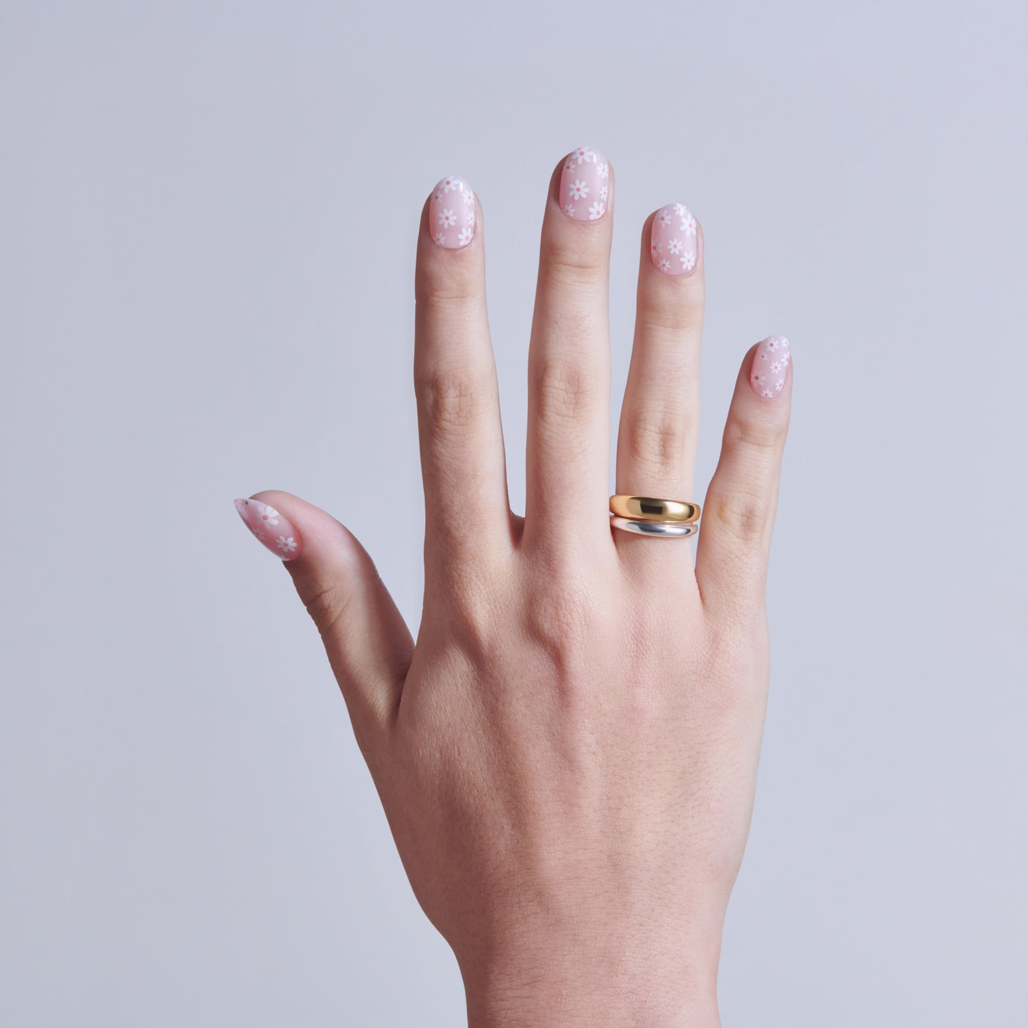 Profile of KISS short round nail shape showing comfortable fit on natural nail