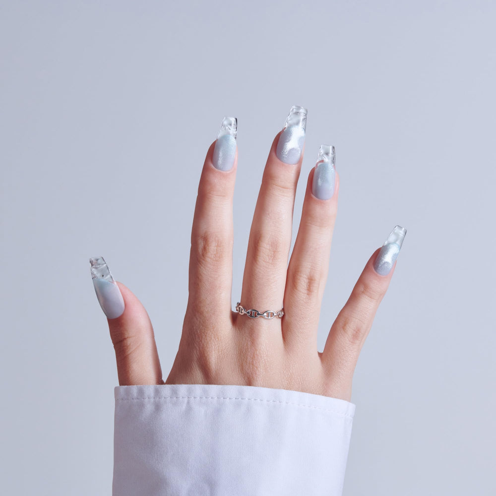 KISS top view of blue coffin nails displaying shape and glossy finish