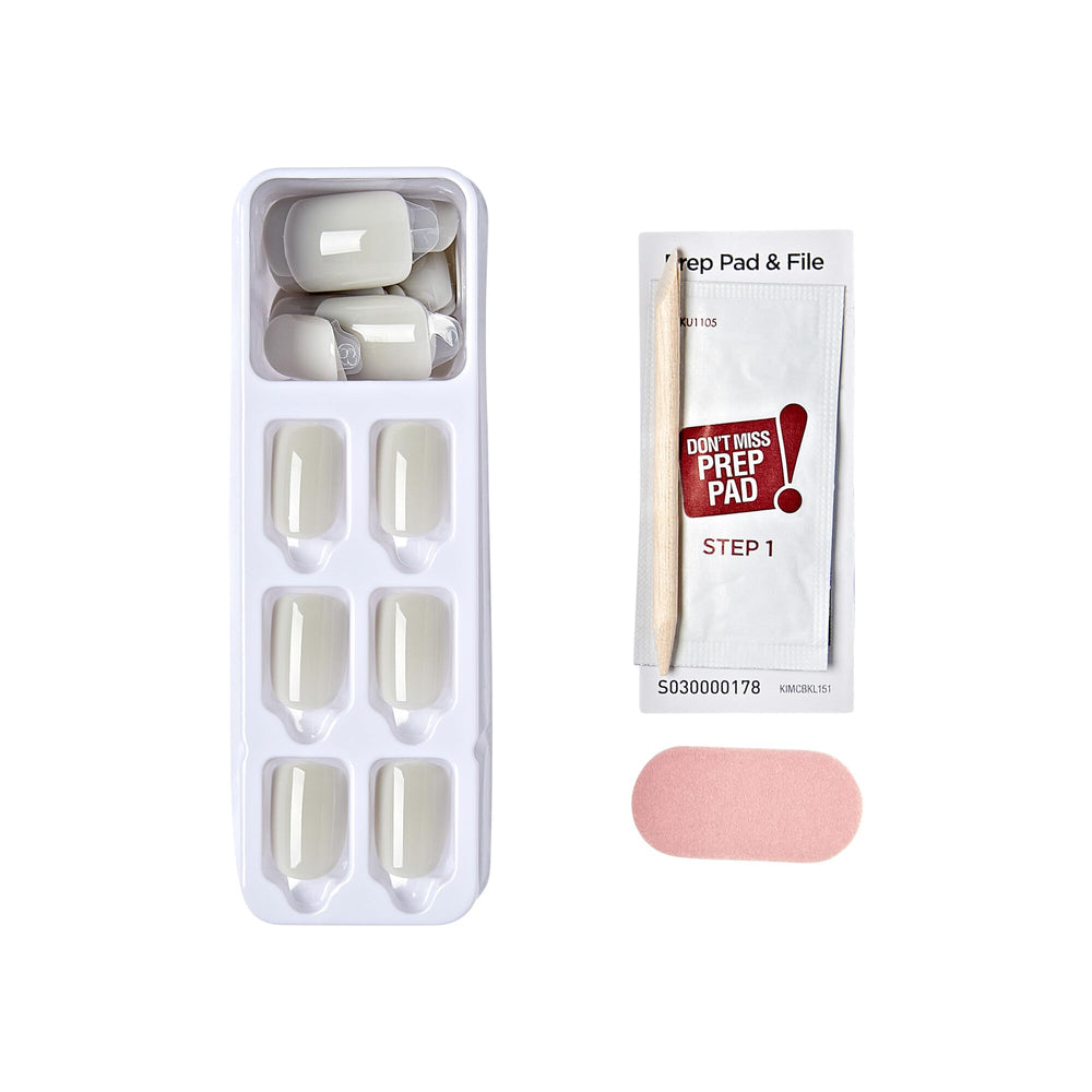 KISS hand applying a nail with peel-and-press adhesive for quick application