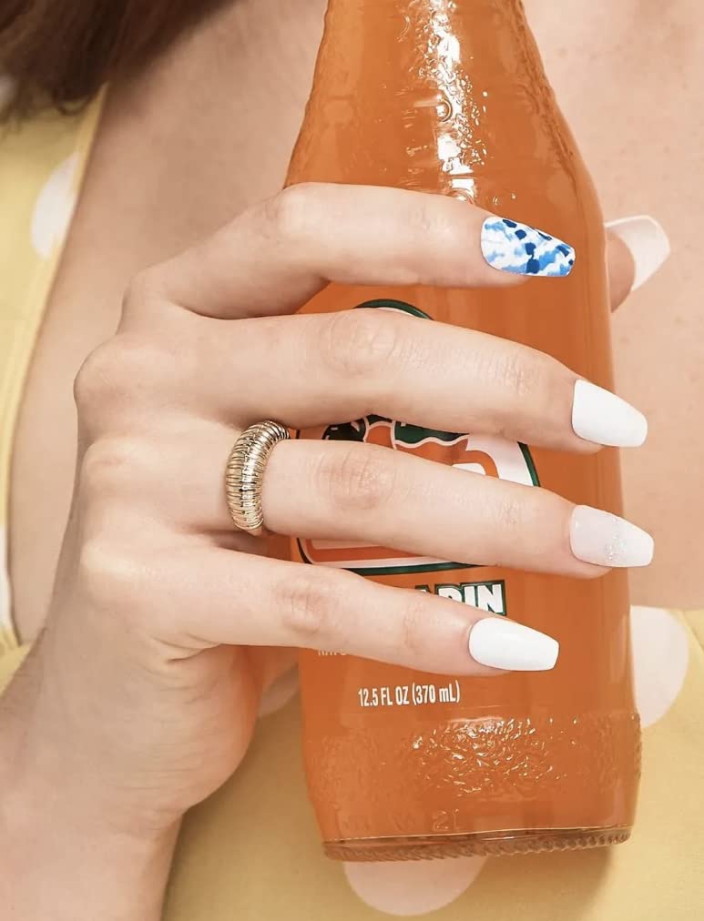 KISS nails on hand showing medium coffin size and realistic scale for styling choice