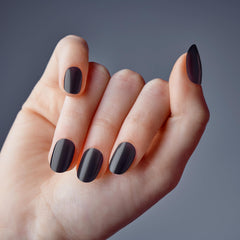 KISS close-up of jelly black nail shine highlighting glass-like reflective finish