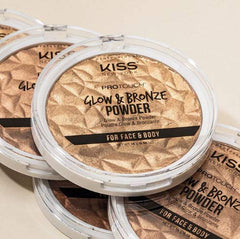 Kiss bronzer held in hand to show pan size and portability useful for body coverage