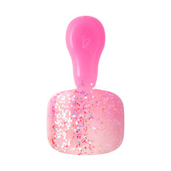KISS press-on toenail in hand ready to apply for fast at-home pedicure