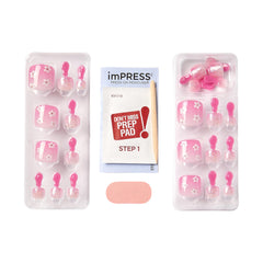 KISS close-up of pink press-on toenail displaying smooth finish and salon look