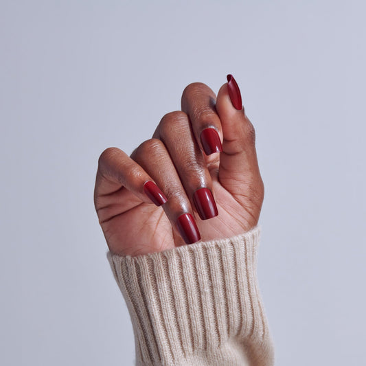 Close-up of KISS nail surface texture highlighting smooth color finish and chip resistance benefit