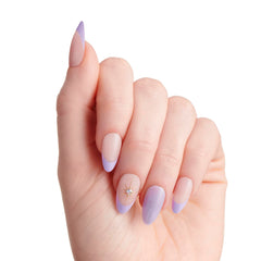 KISS nails being applied with pink gel glue showing quick application benefit