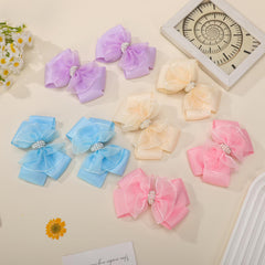KISZU beige bows set in lifestyle scene shows outfit coordination