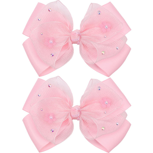 Kiszu front view of pink bow clip showing overall shape and charm