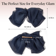 Kitsch Blue Orchid half-up style showing feminine finishing touch