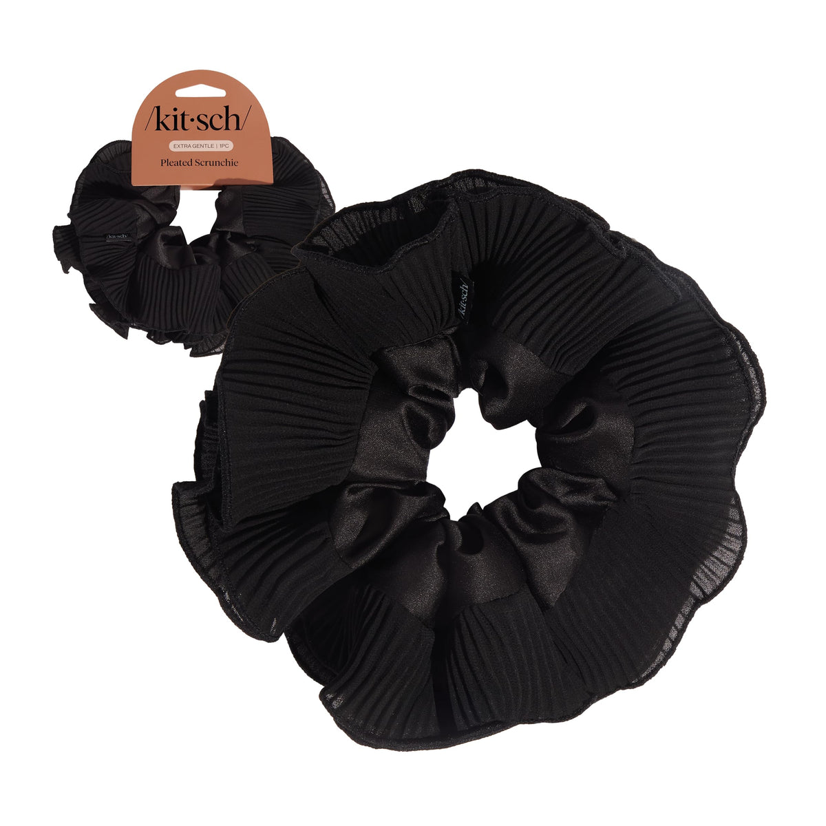 Kitsch front view of scrunchie packaging showing elegant black pleated design and gift-ready look