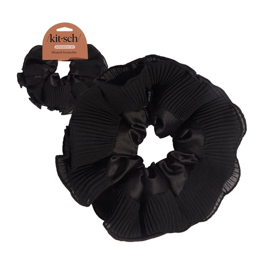 Kitsch front view of scrunchie packaging showing elegant black pleated design and gift-ready look